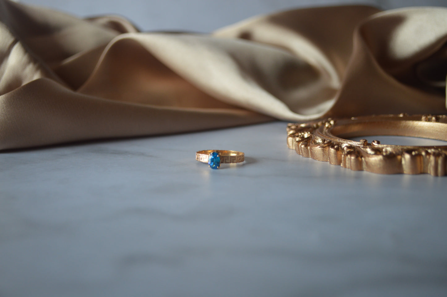Original gold ring with light blue stone