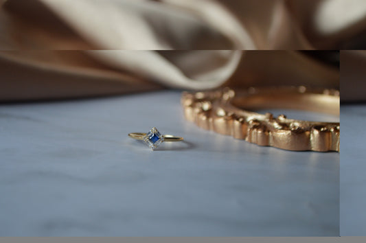 Gold ring with blue stone