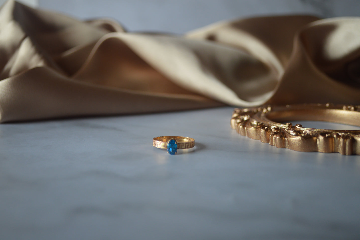 Original gold ring with light blue stone