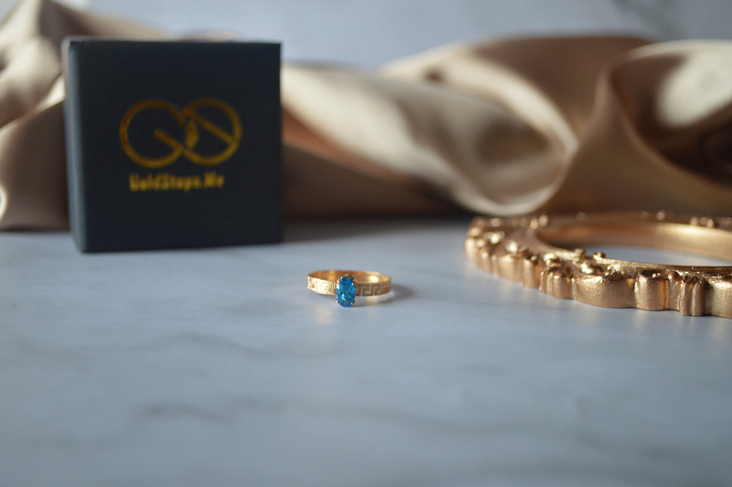 Original gold ring with light blue stone